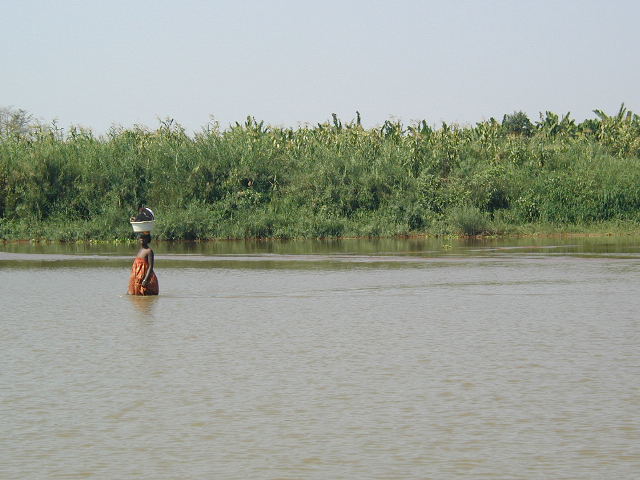 woman wading in river