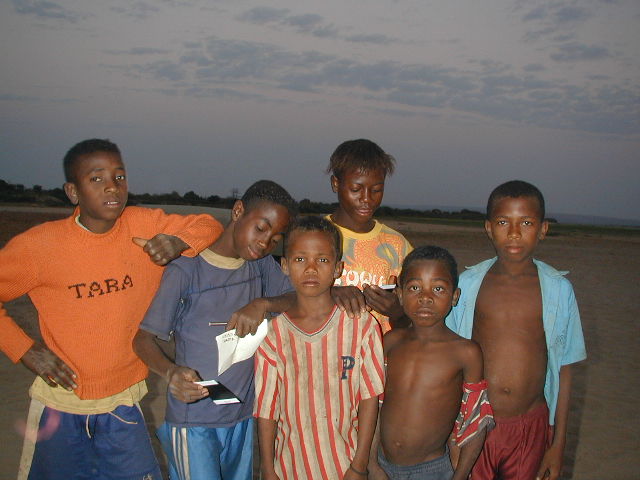 children in river village